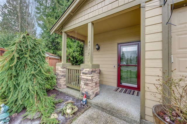 doorway to property with a porch