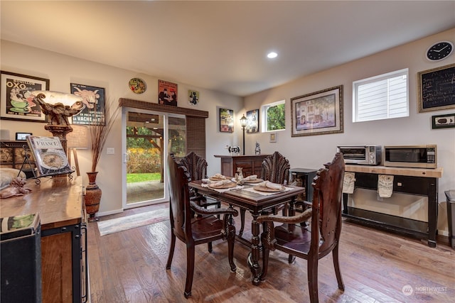 dining room with light wood-type flooring