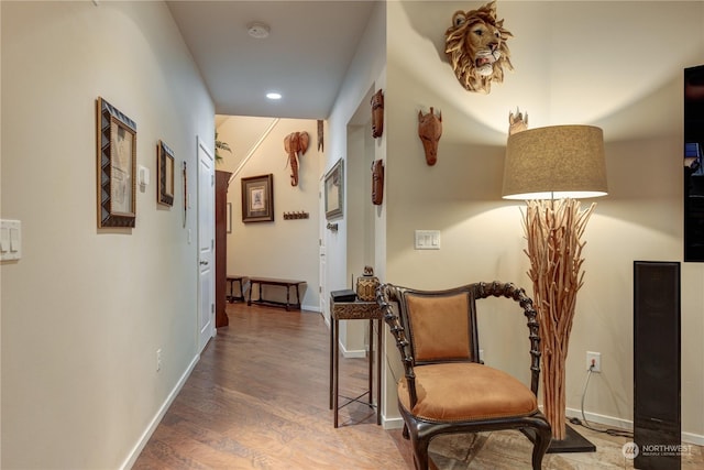 hallway with dark hardwood / wood-style flooring