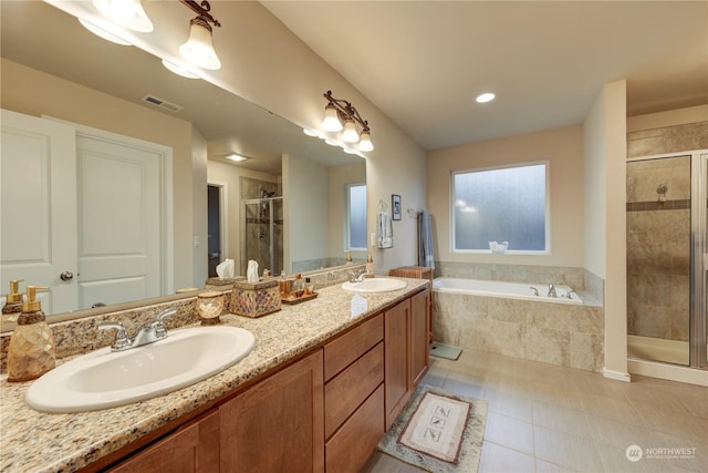 bathroom with vanity and separate shower and tub