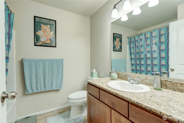 bathroom featuring vanity, toilet, and tile patterned flooring