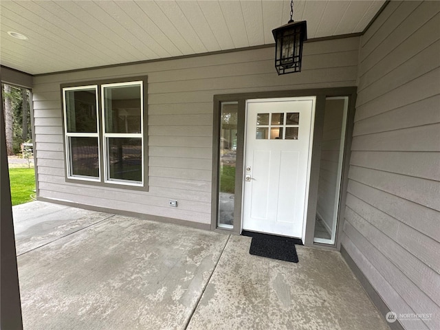 entrance to property with a patio area