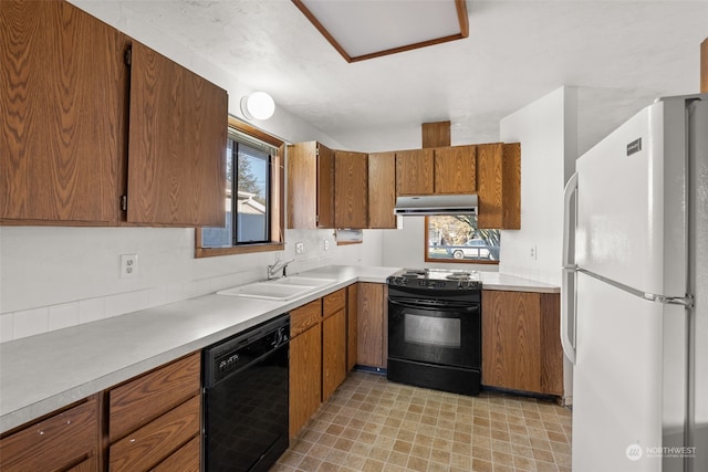 kitchen featuring sink and black appliances