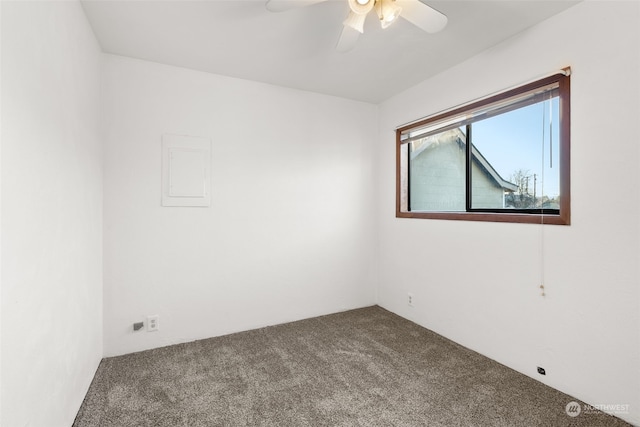 spare room with carpet floors and ceiling fan