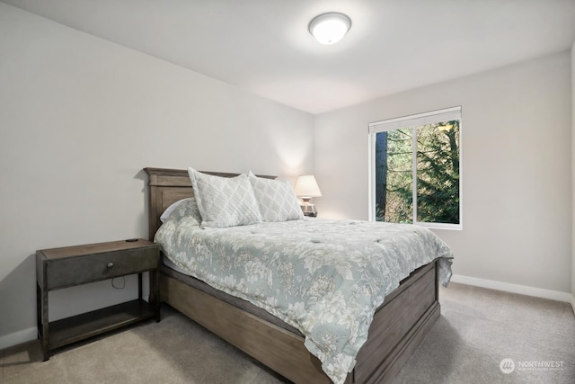 bedroom featuring light carpet