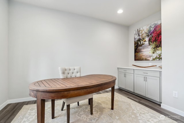 dining space with hardwood / wood-style flooring