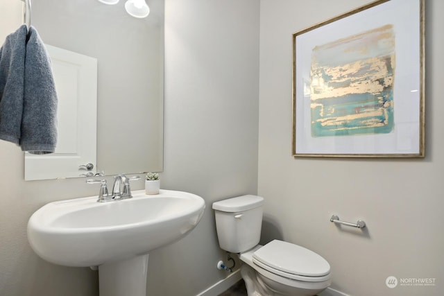 bathroom with sink and toilet