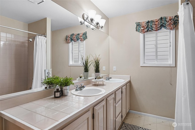 bathroom with vanity and a chandelier