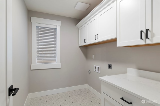 laundry area with cabinets, washer hookup, and electric dryer hookup