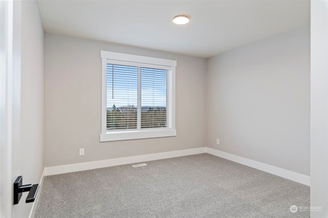 unfurnished room featuring carpet floors