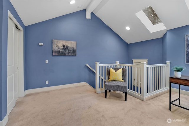 bedroom with light carpet, a closet, and vaulted ceiling with skylight