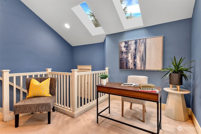 carpeted office with vaulted ceiling with skylight