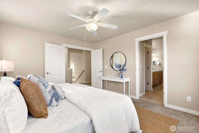 bedroom featuring baseboards, light carpet, and ceiling fan