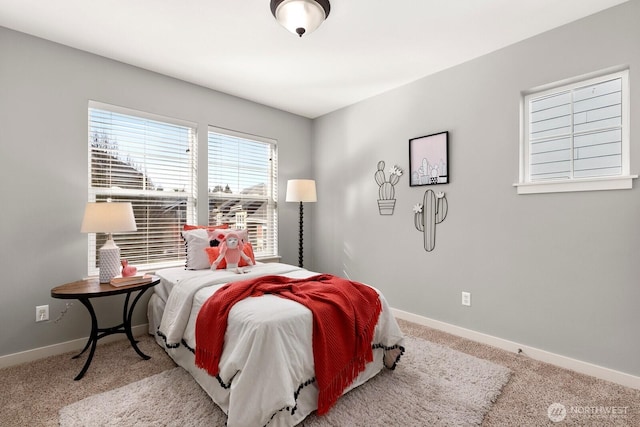 bedroom featuring carpet and baseboards