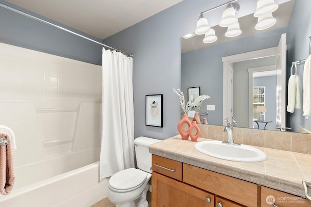 full bathroom featuring vanity, toilet, and shower / bathtub combination with curtain