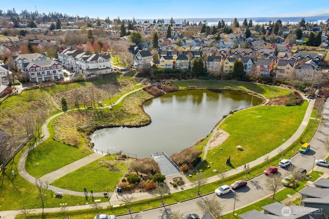 aerial view with a residential view and a water view