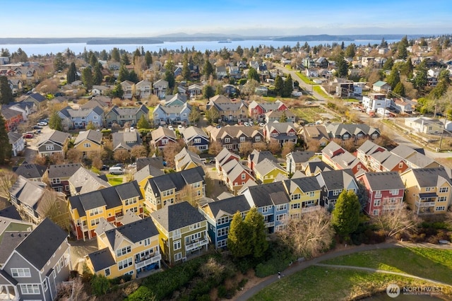 birds eye view of property featuring a residential view and a water view