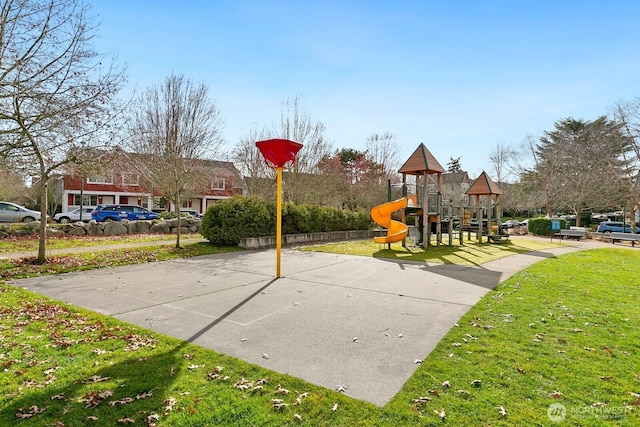 community play area featuring a lawn