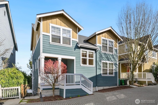 view of front facade with a porch and board and batten siding