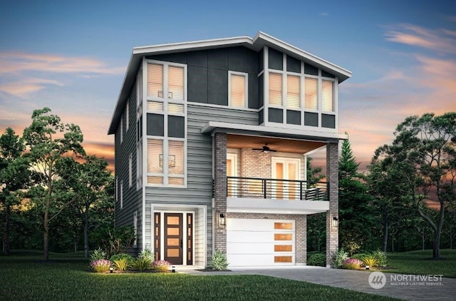 contemporary house featuring ceiling fan, a garage, and a balcony