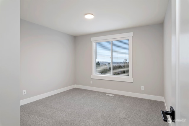 empty room featuring carpet flooring