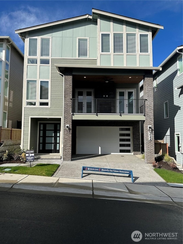 contemporary house with an attached garage and driveway