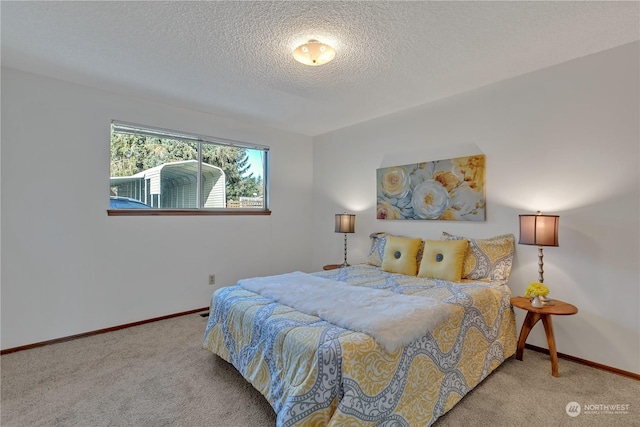 carpeted bedroom with a textured ceiling