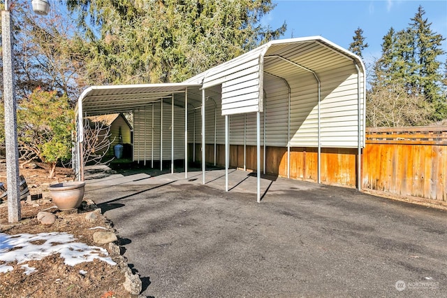 view of vehicle parking featuring a carport