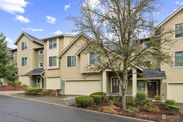 townhome / multi-family property featuring a garage