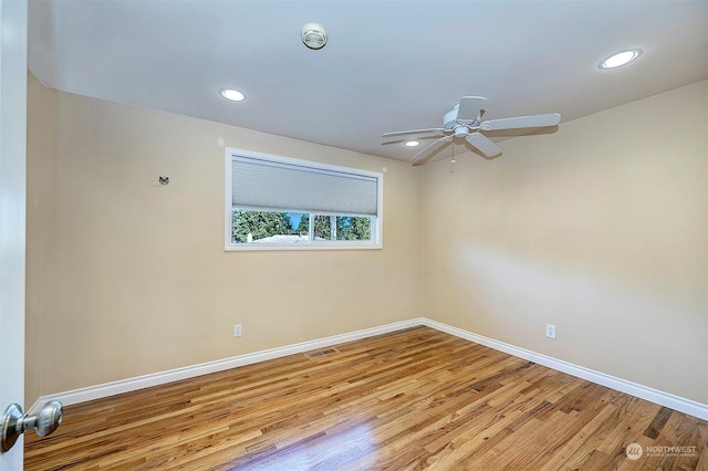 spare room featuring ceiling fan and light hardwood / wood-style flooring