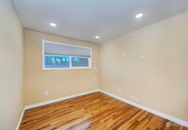 unfurnished room with light hardwood / wood-style flooring