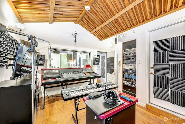 kitchen featuring lofted ceiling with beams, wood ceiling, and light hardwood / wood-style floors