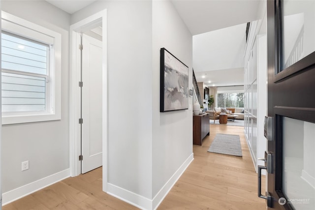 hallway with light wood-type flooring