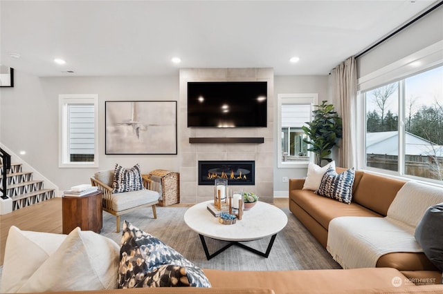 living room with a tiled fireplace