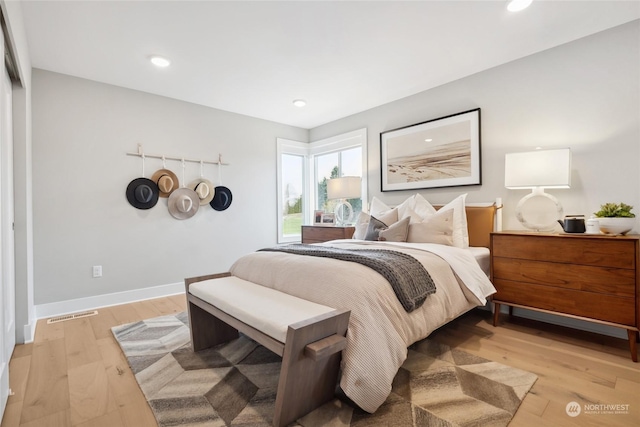 bedroom featuring light wood-type flooring