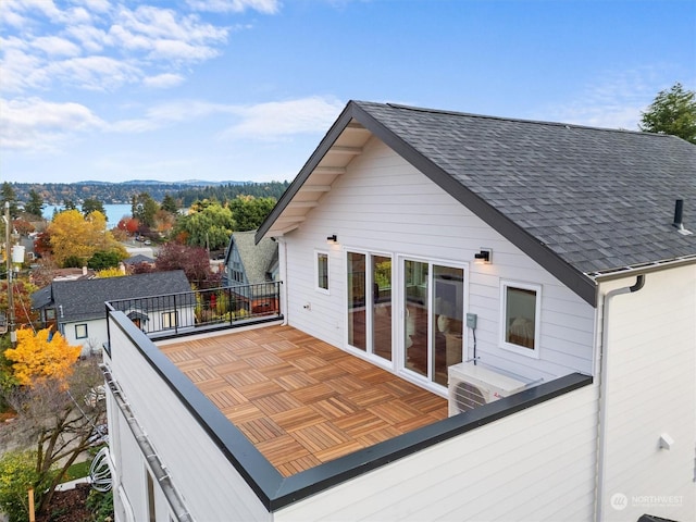 back of property featuring a balcony