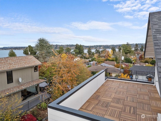 balcony featuring a water view