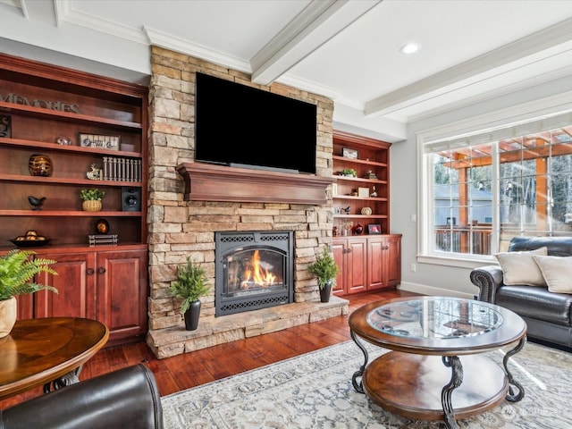 living area featuring crown molding, a fireplace, wood finished floors, beamed ceiling, and baseboards