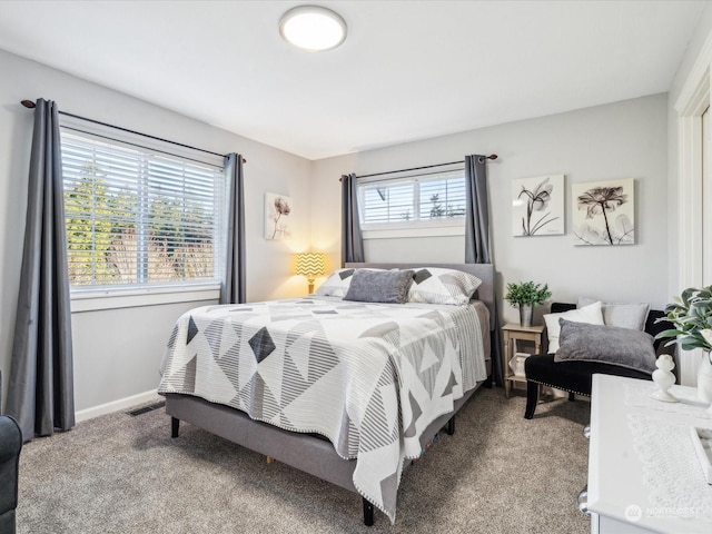 bedroom with carpet flooring, visible vents, and baseboards