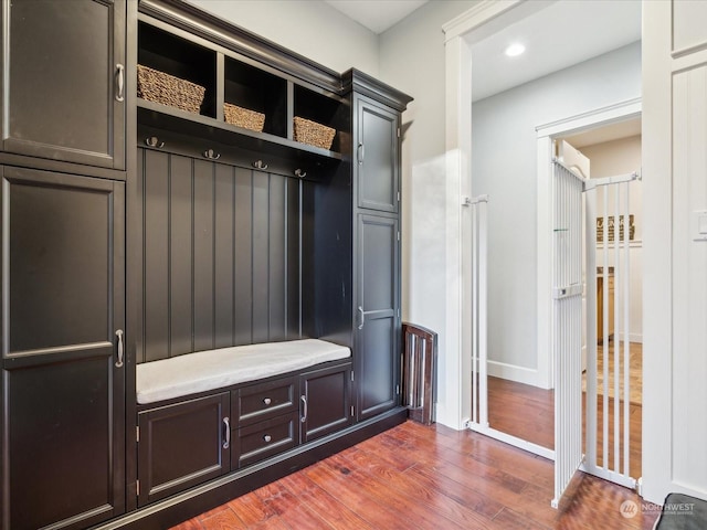 mudroom featuring recessed lighting, dark wood finished floors, and baseboards