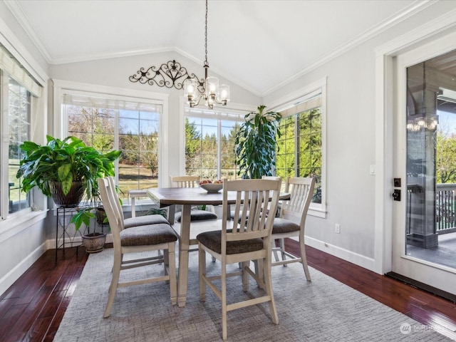 sunroom featuring a chandelier and vaulted ceiling