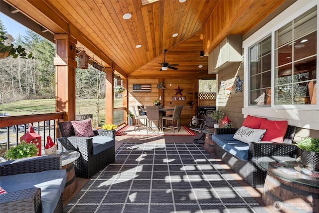 view of patio / terrace with outdoor dining area, a ceiling fan, and an outdoor living space