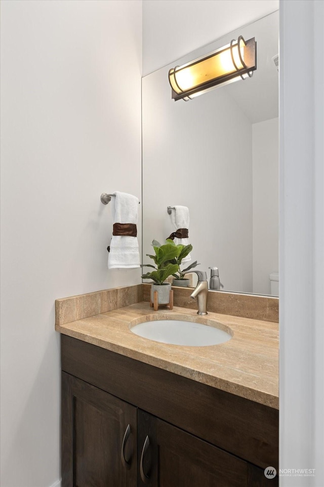 bathroom with vanity and toilet