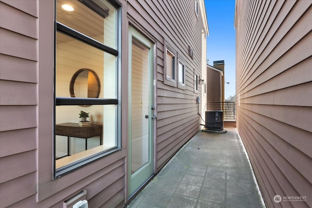 view of home's exterior with a patio and cooling unit