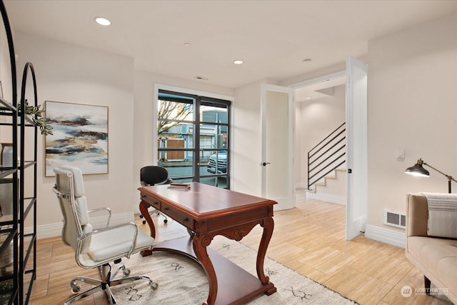 home office featuring light hardwood / wood-style floors