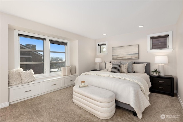 carpeted bedroom featuring multiple windows