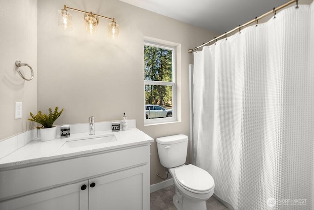 full bath featuring vanity, tile patterned floors, and toilet