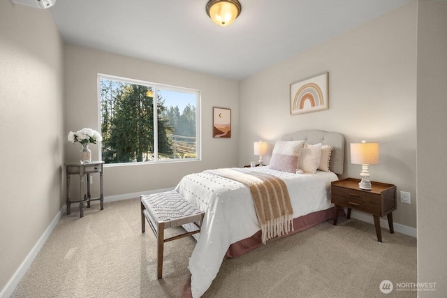 bedroom with baseboards and carpet flooring