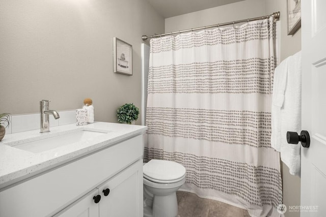 full bath with vanity, curtained shower, and toilet