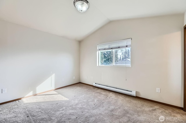 carpeted empty room featuring vaulted ceiling, a baseboard radiator, and baseboards